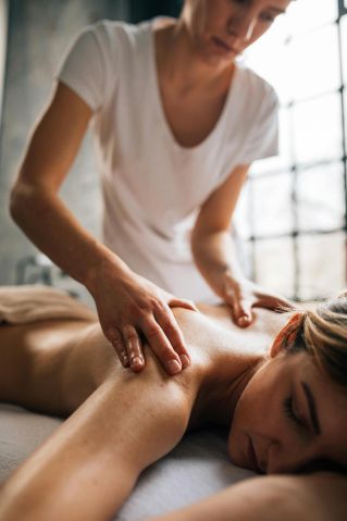 A calming indoor massage session focusing on relaxation and self-care.